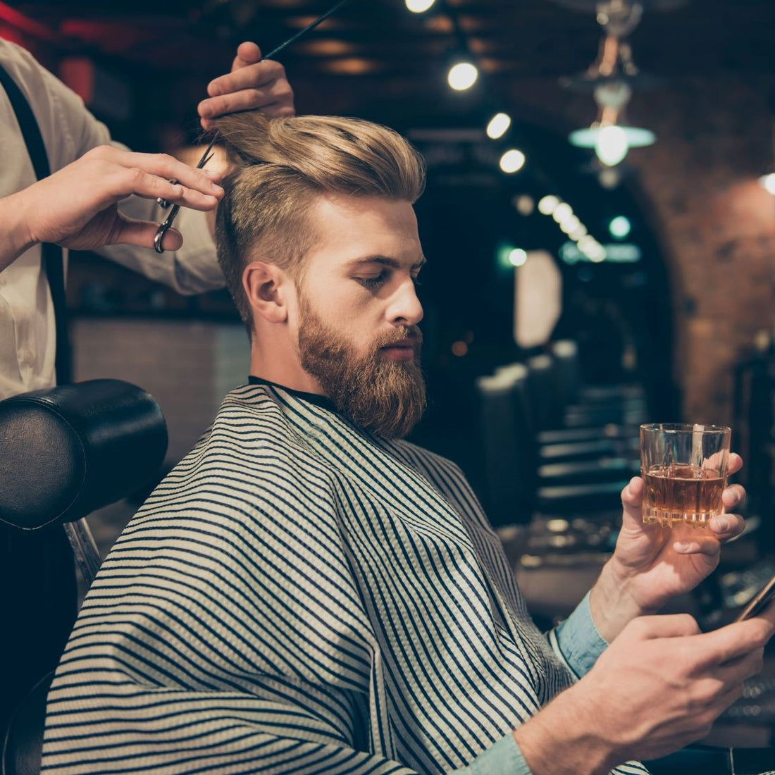 Man getting a haircut at a barber shop